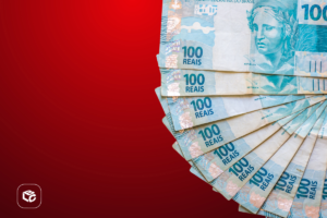 Cédulas de dinheiro brasileiro em formato circular sobre fundo vermelho, representando valores financeiros, pagamento e crédito judicial.